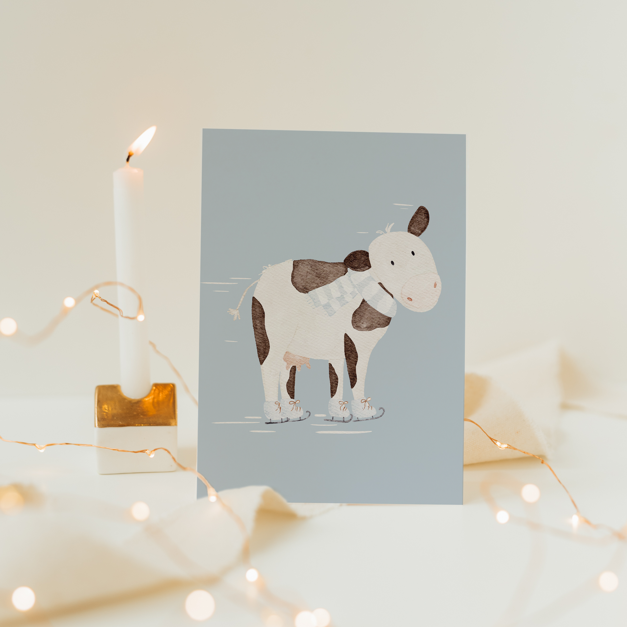 Weihnachtskarte Kuh fährt Schlittschuh